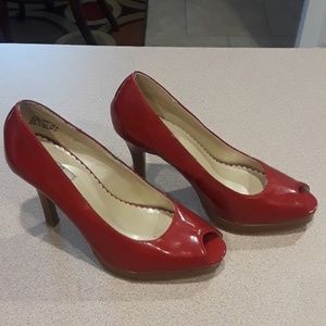 Red patten leather pumps